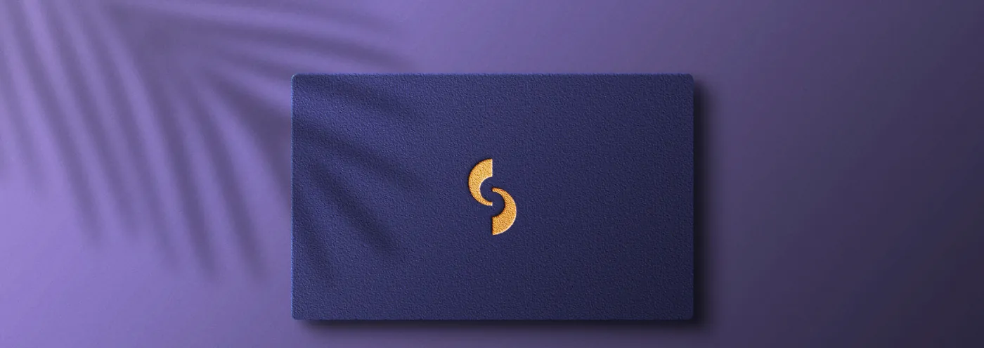 Indigo business card with the peach monogram